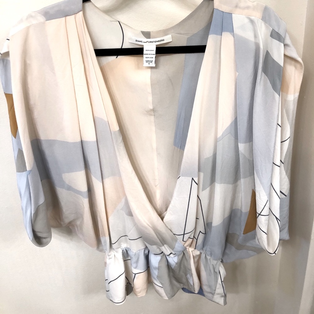 100% Silk.  Diane von Furstenberg blouse